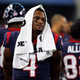 Deshaun Watson (4) walks along the sideline in the first half of a preseason NFL football game against the Dallas Cowboys in Arlington, Texas, on Aug. 24, 2019. Thirty women who had accused the Houston Texans of turning a blind eye to allegations that Watson was sexually assaulting and harassing women during massage sessions have settled their legal claims against his former team, the Houston Texans, their attorney said Friday, July 15, 2022. Watson, who has since been traded to the Cleveland Browns, has denied any wrongdoing and vowed to clear his name.